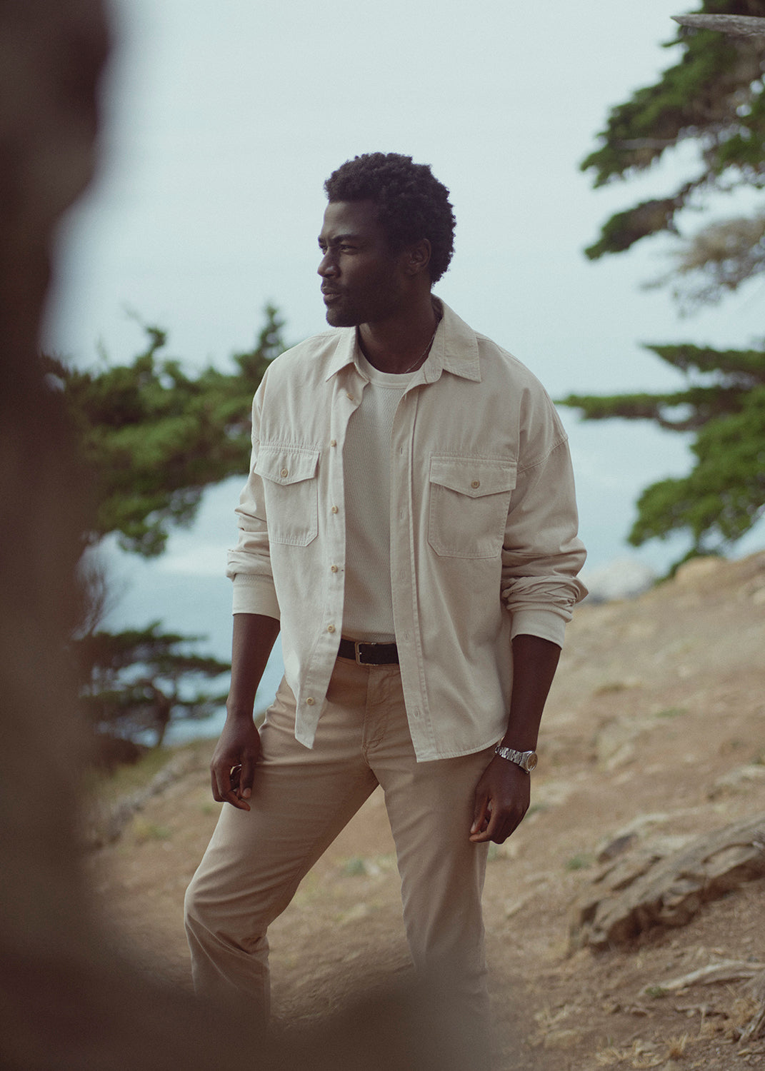 A man wearing Gage in Catalina, Shigoto Shirt in Light Taupe, and Waffle Crewneck in Plaster 