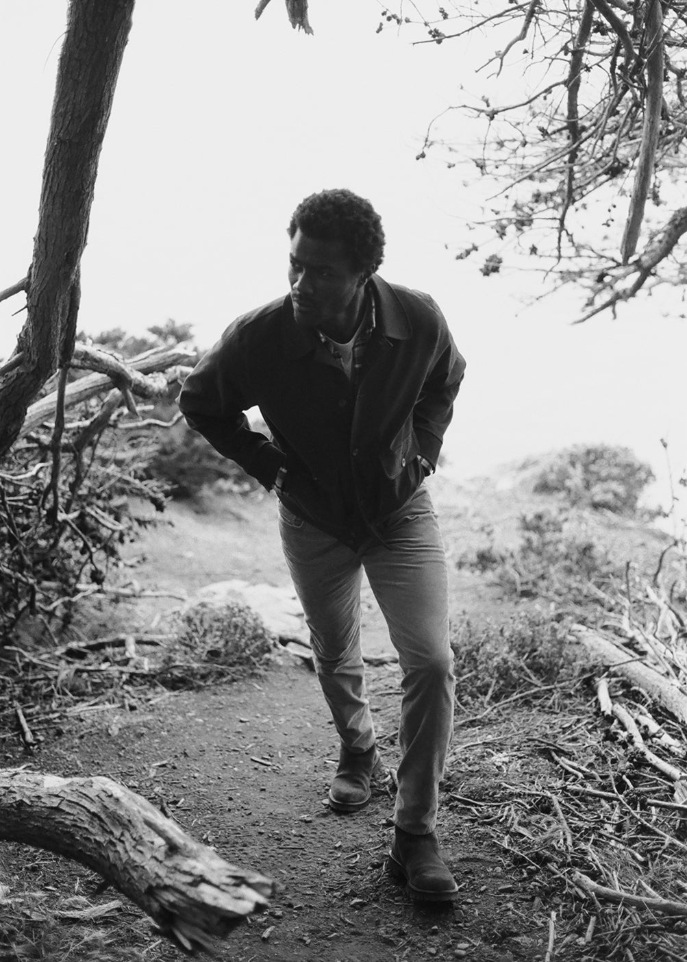 A man wearing Gage in Catalina, Utility Jacket in Dark Olive, Shigoto Shirt in Rambler Plaid, and Everyday Short Sleeve Tee in Heather Grey