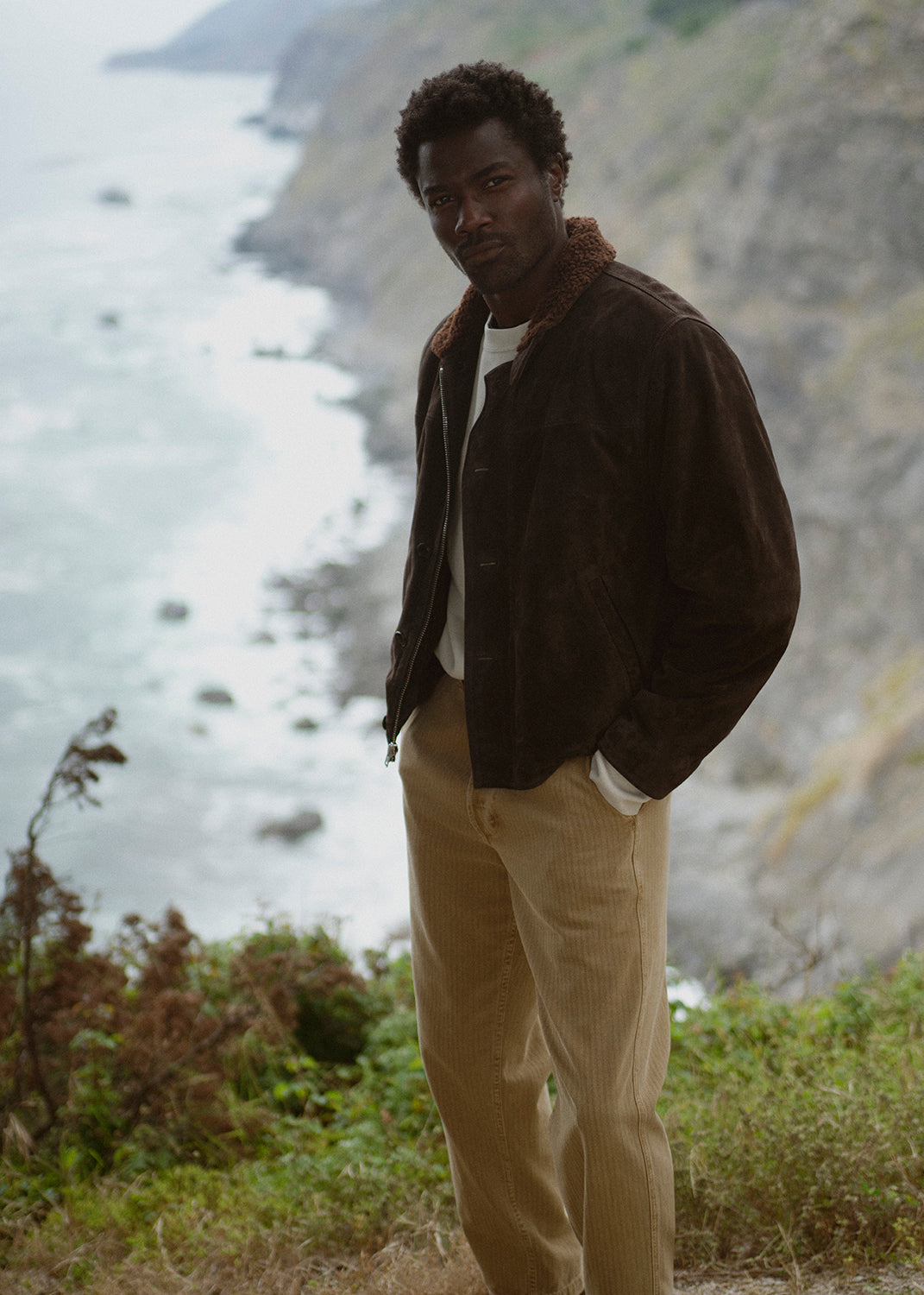 A man wearing Belgian Chino in Tan, Deck Jacket in Brown, and Vintage Crewneck in Abalone