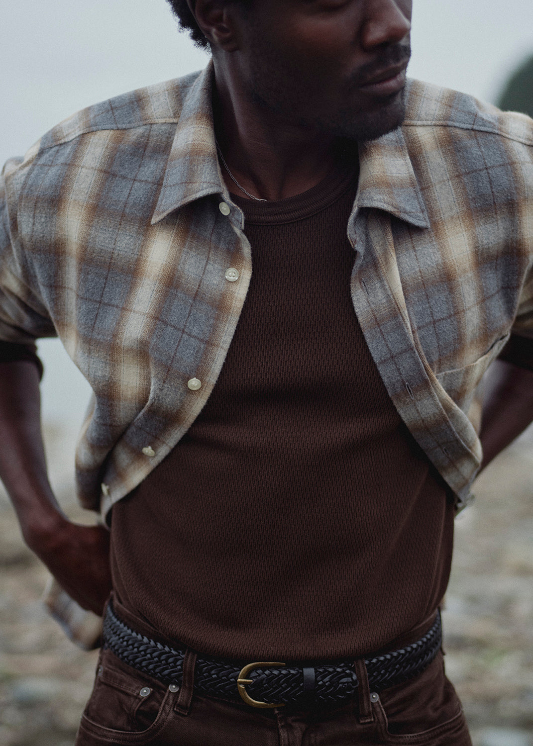 A man wearing Elijah Perform Denim in Tobacco, Long Sleeve Cairo Shirt in Cascade Plaid, and Waffle Crewneck in Tobacco