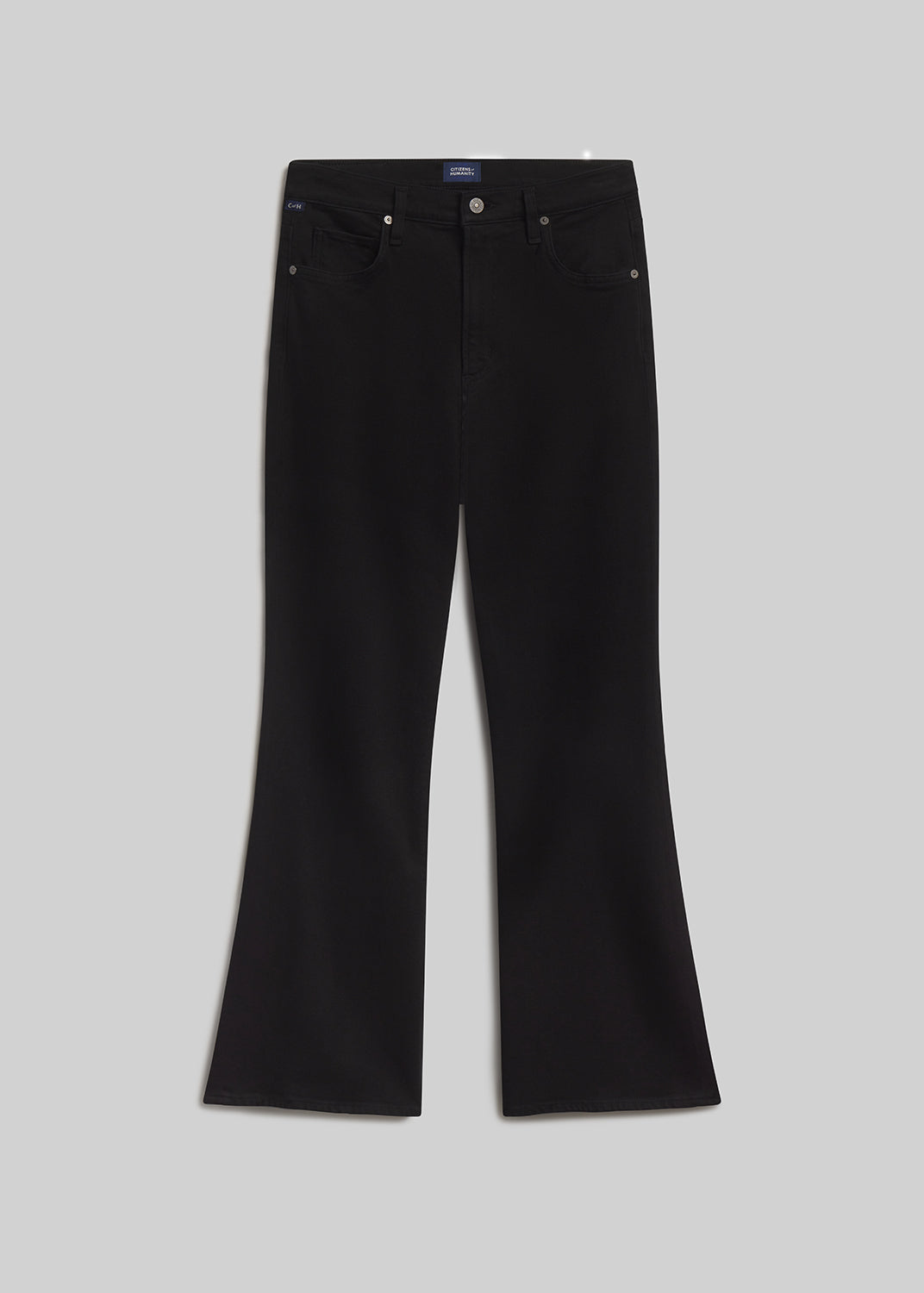 Black bootcut jeans on grey background