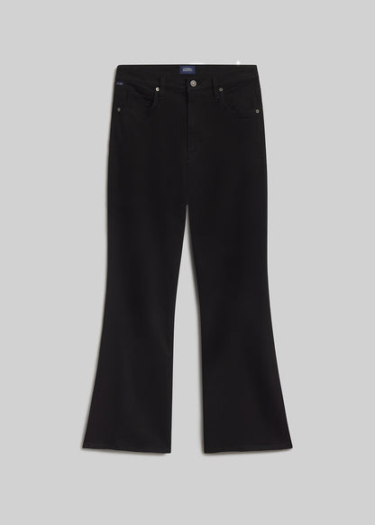 Black bootcut jeans on grey background