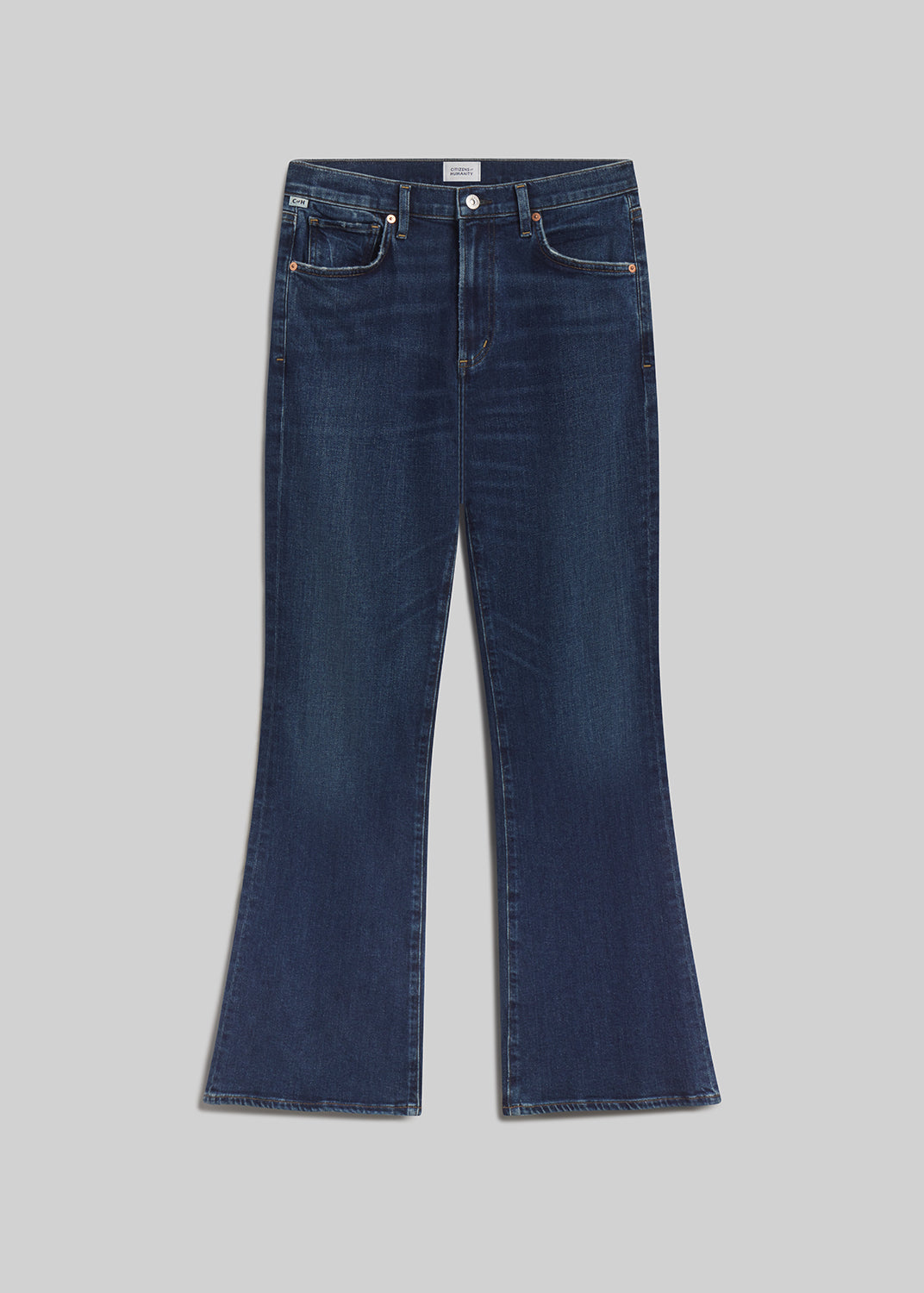 Dark blue bootcut jeans on grey background