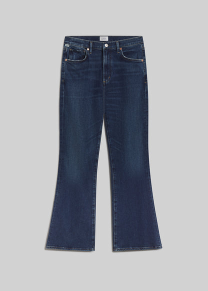 Dark blue bootcut jeans on grey background