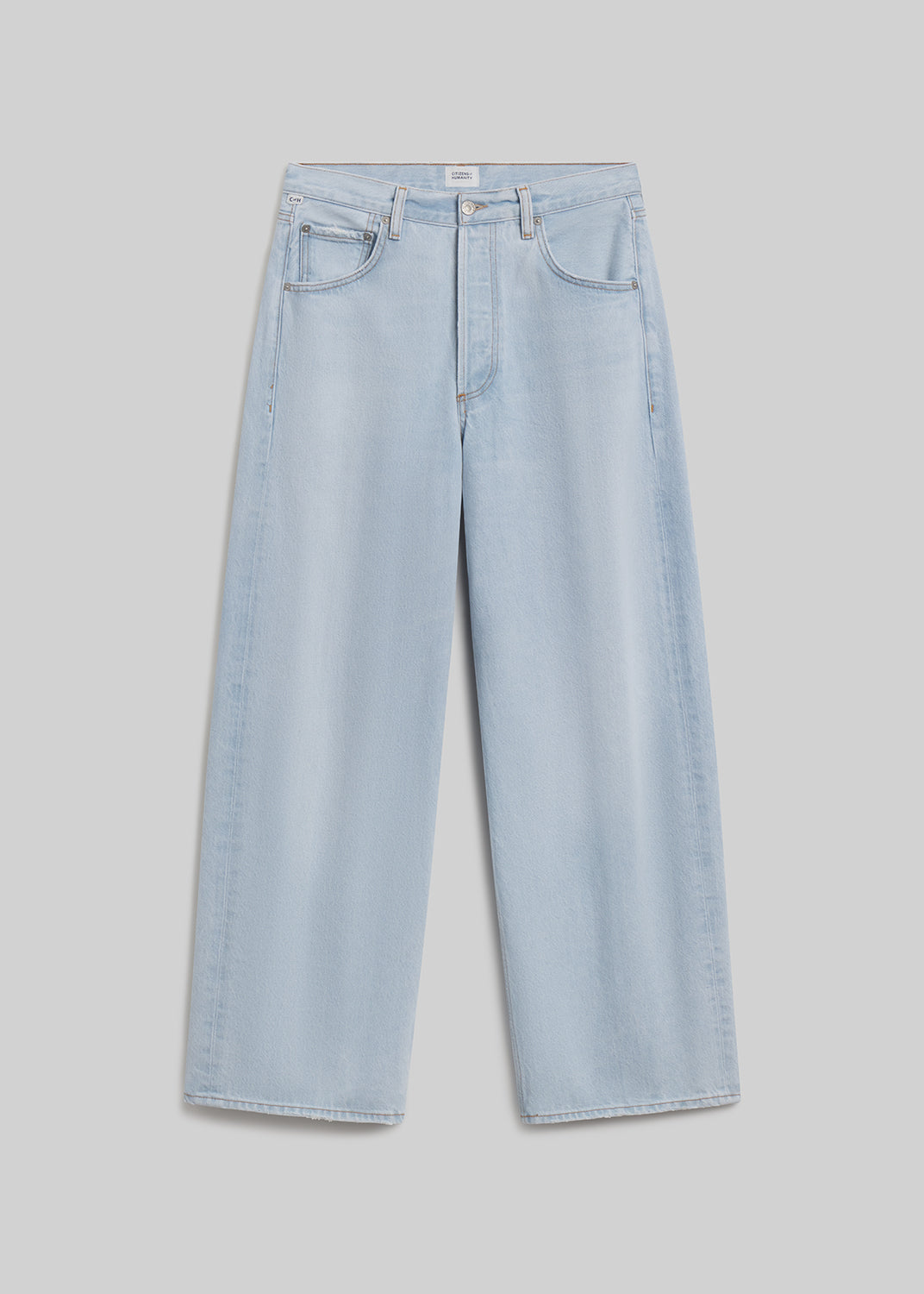 Light blue wide-leg jeans on grey background