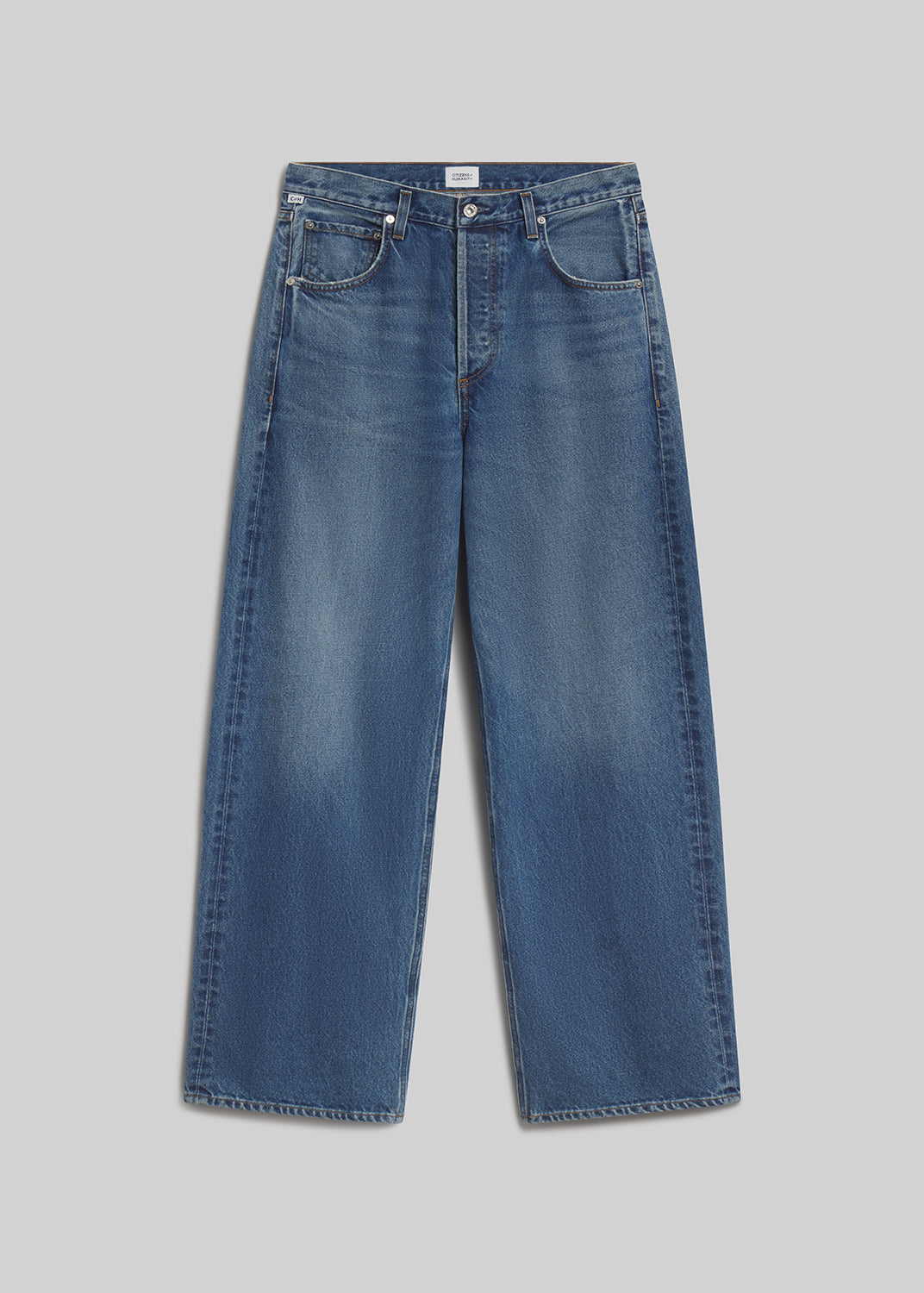 Medium blue wide-leg jeans on grey background