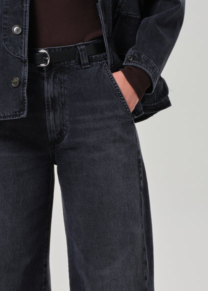 Person wearing washed black jean