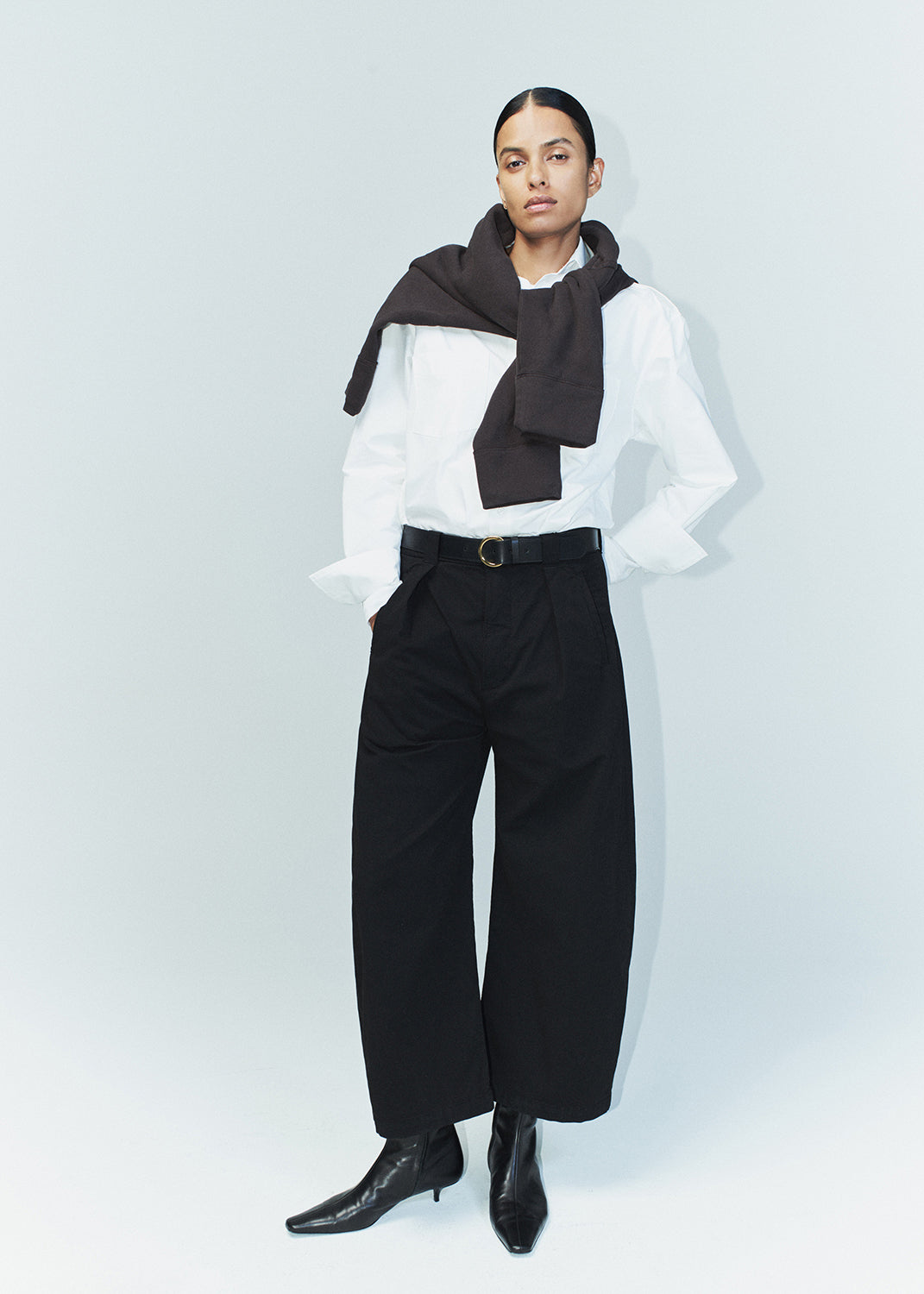 Cara Cropped Pleated Trouser in Black styled on model