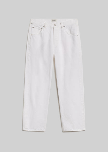White cropped straight-leg jeans on grey background