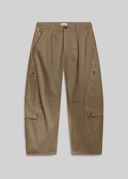 Olive green cargo pants on grey background