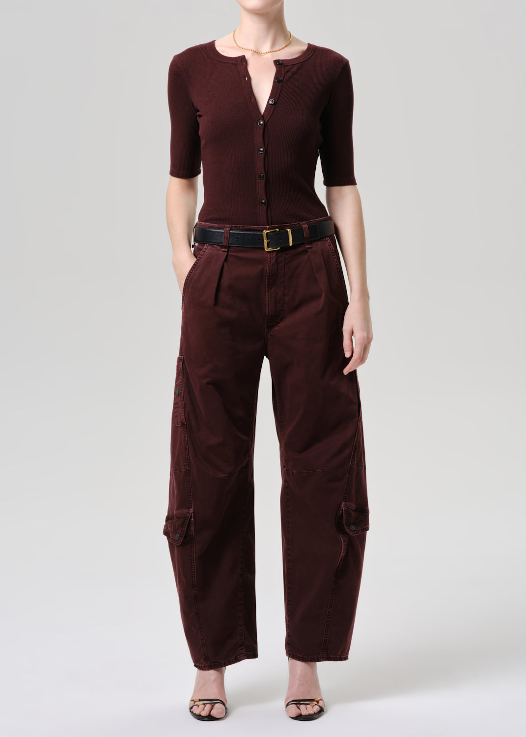 Women wearing mahogany top and cargo pants
