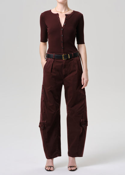 Women wearing mahogany top and cargo pants