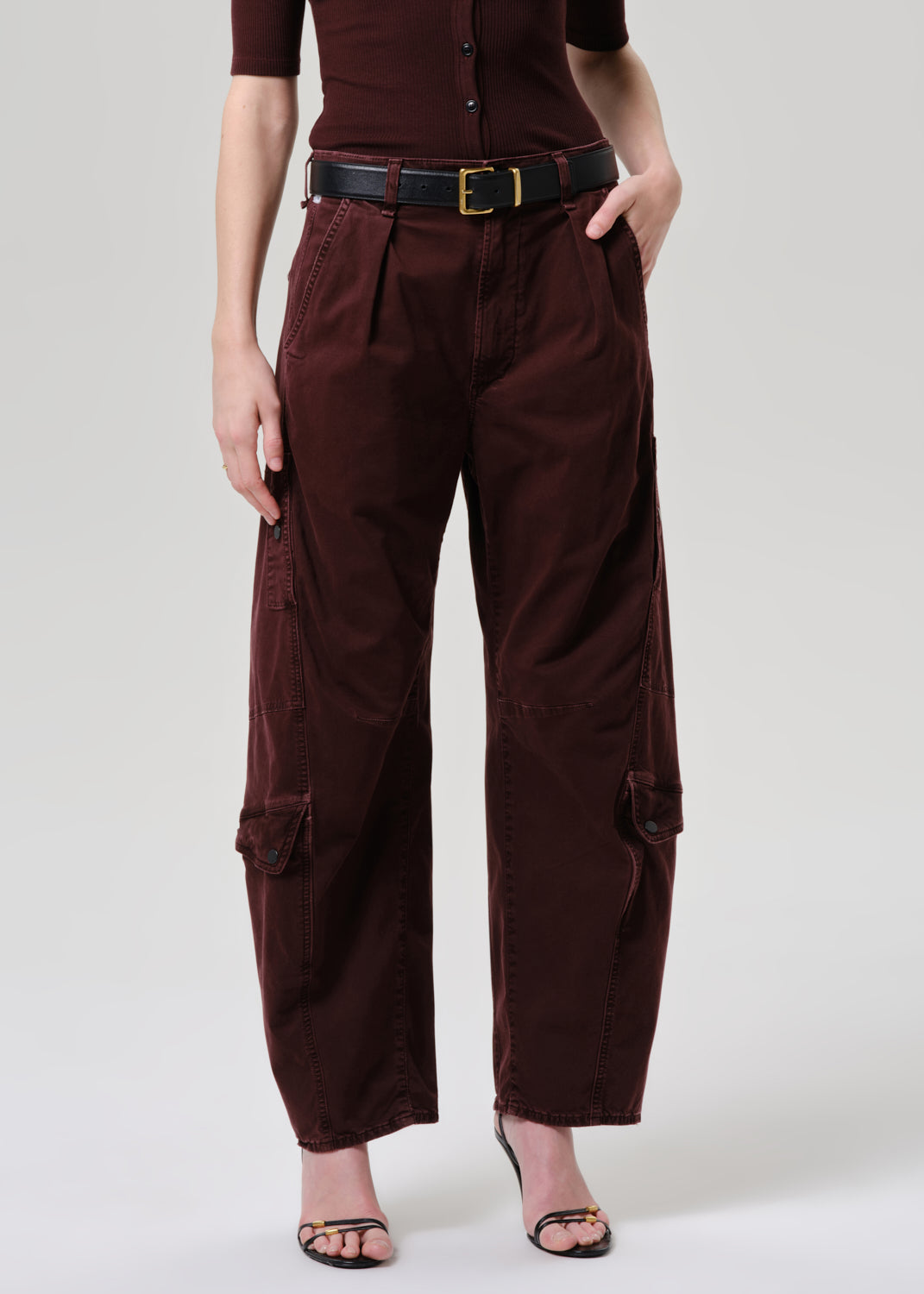 Women wearing mahogany top and cargo pants