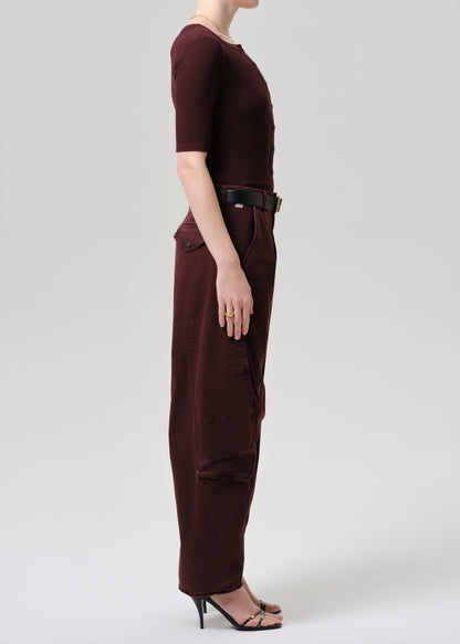Women wearing mahogany top and cargo pants