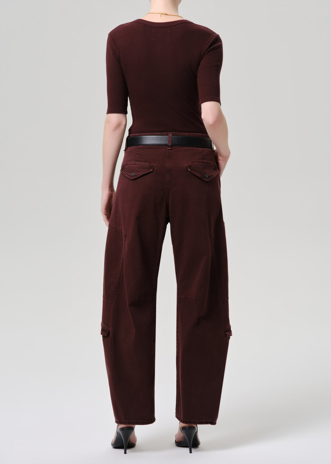 Women wearing mahogany top and cargo pants