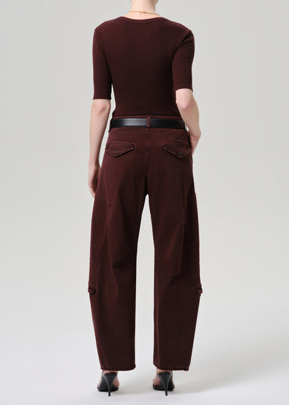 Women wearing mahogany top and cargo pants