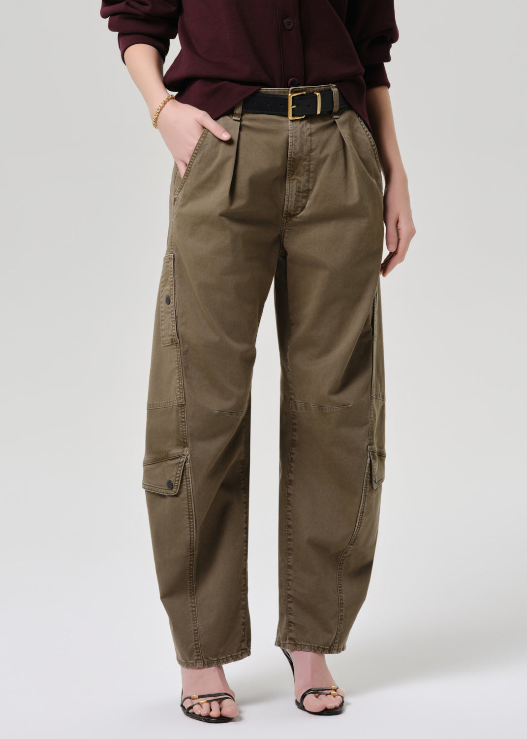 Women wearing mahogany cardigan with army green cargo pants