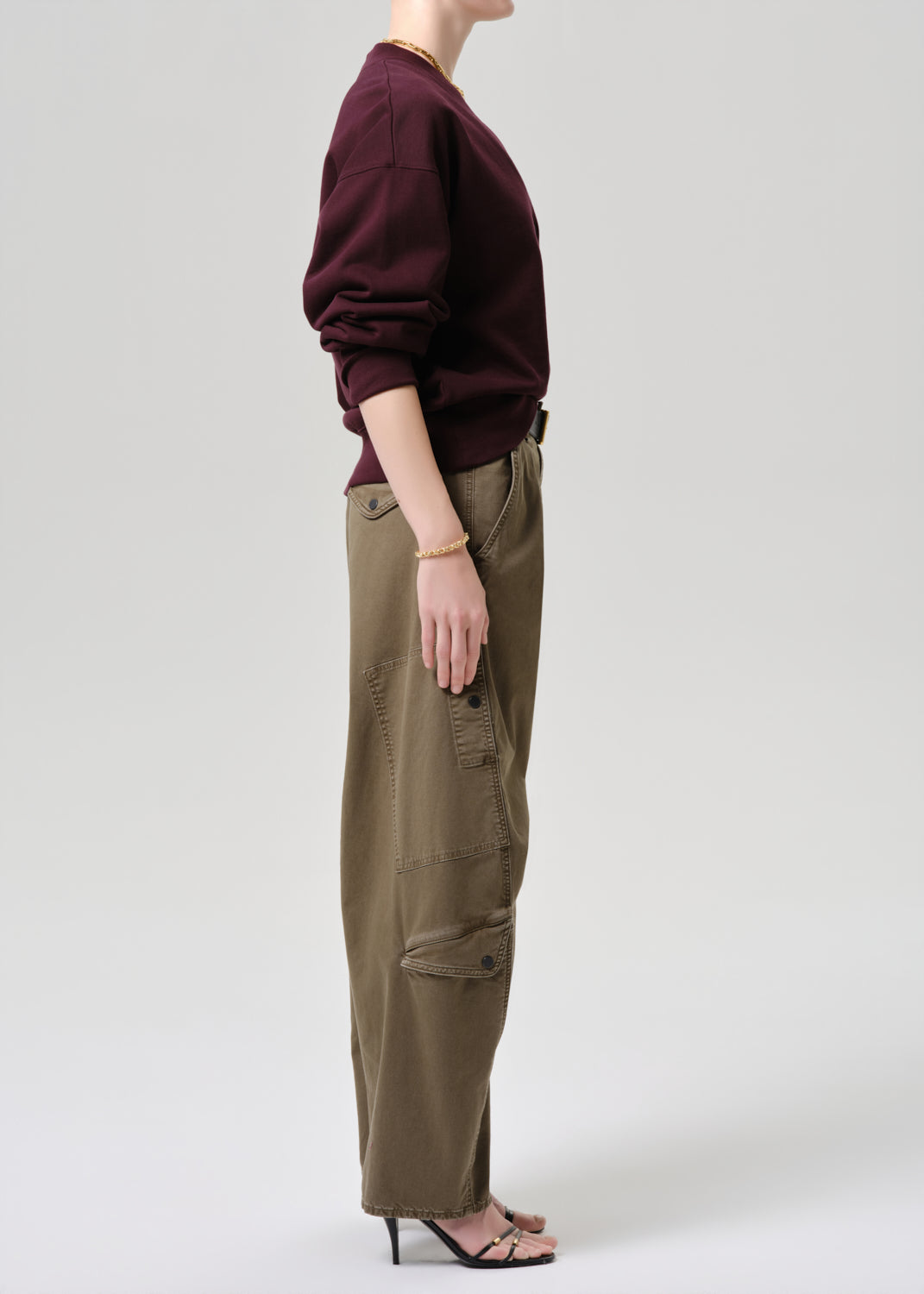 Women wearing mahogany cardigan with army green cargo pants