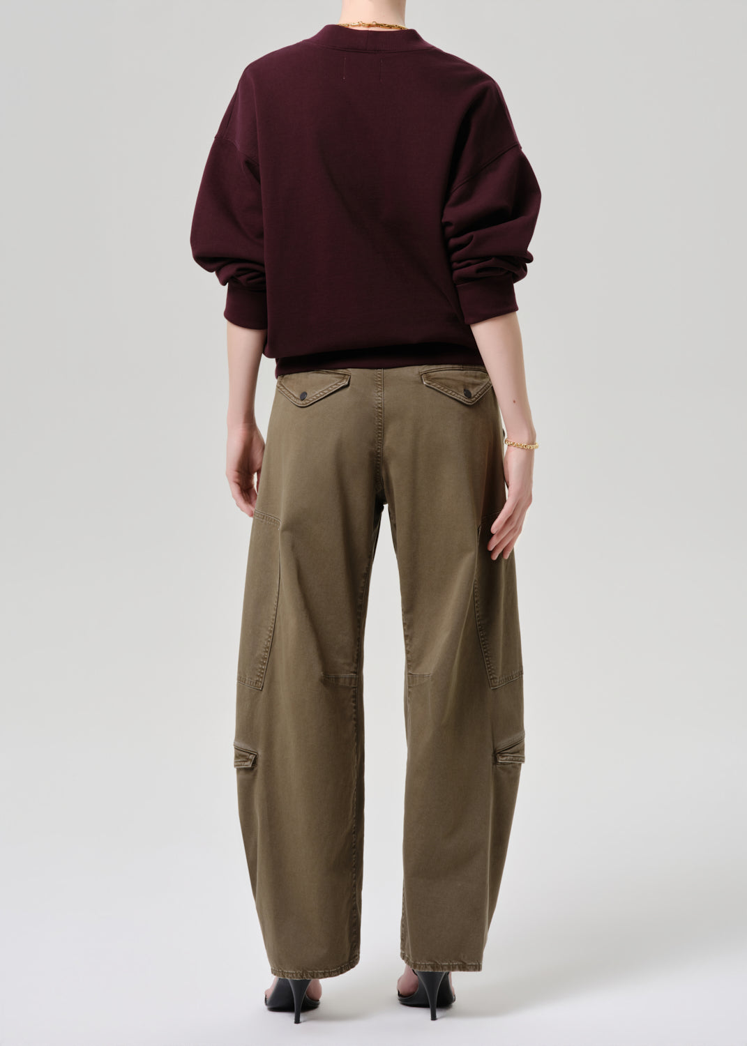 Women wearing mahogany cardigan with army green cargo pants