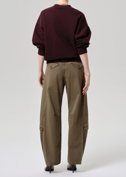 Women wearing mahogany cardigan with army green cargo pants