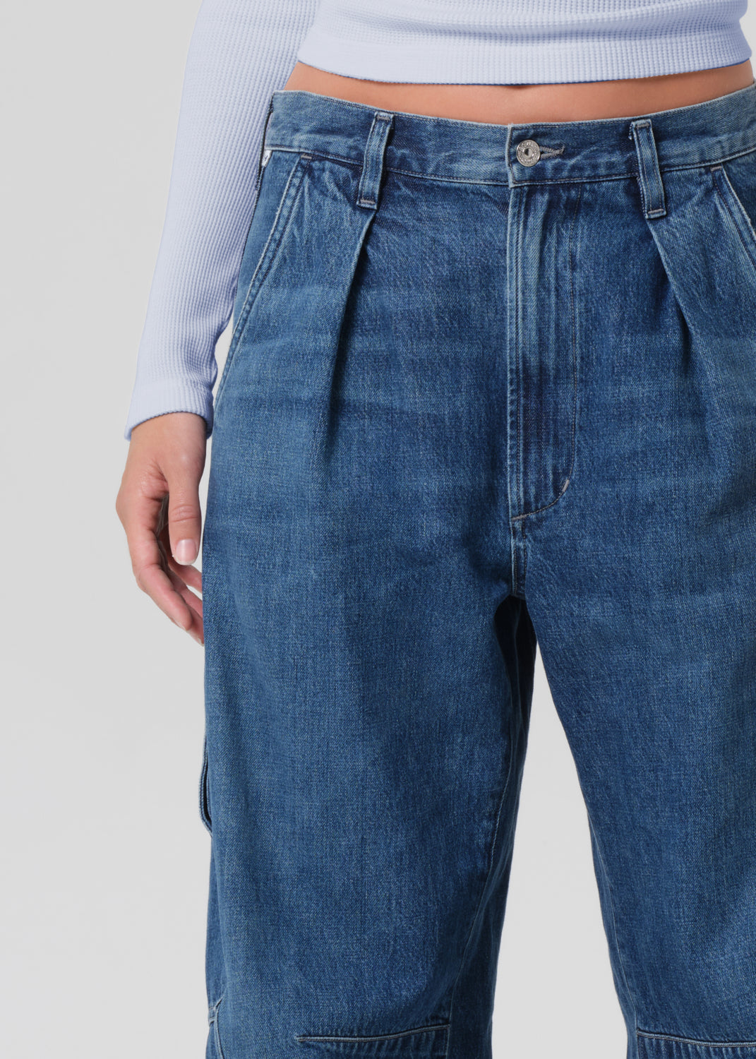 Close-up of blue jeans on a plain background