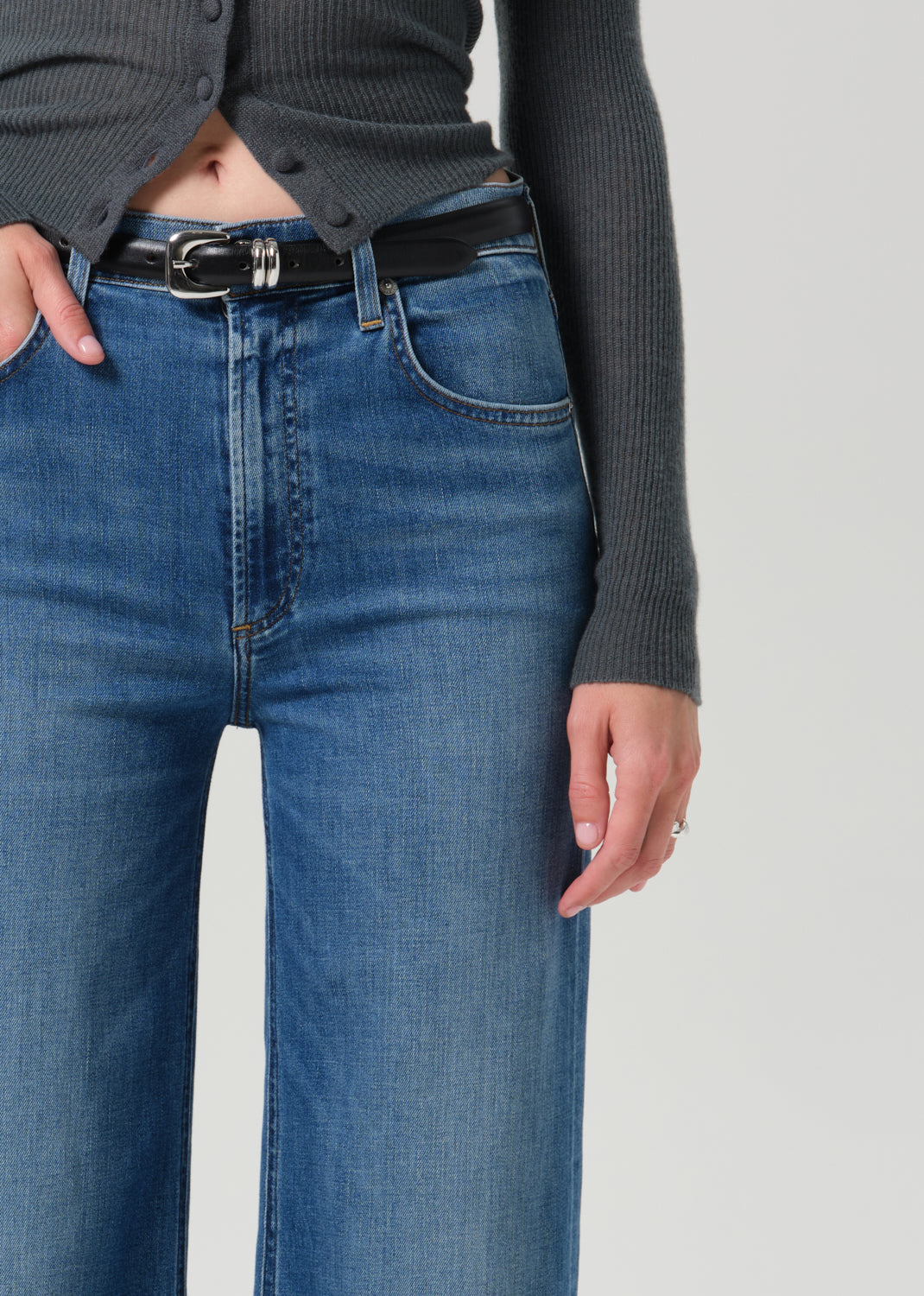 Close up shot of blue pants on a grey background