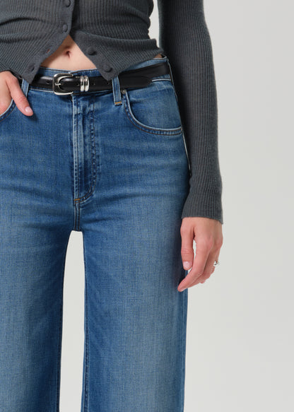Close up shot of blue pants on a grey background