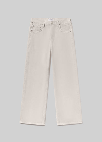 Off-white wide-leg denim jeans with a five-pocket design, belt loops, and button and zipper closure, front flat lay view on a grey background