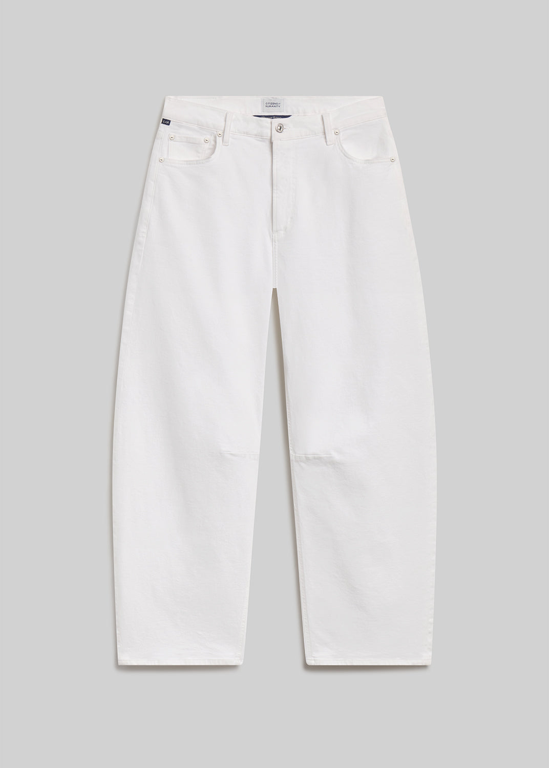 White barrel-leg jeans on grey background