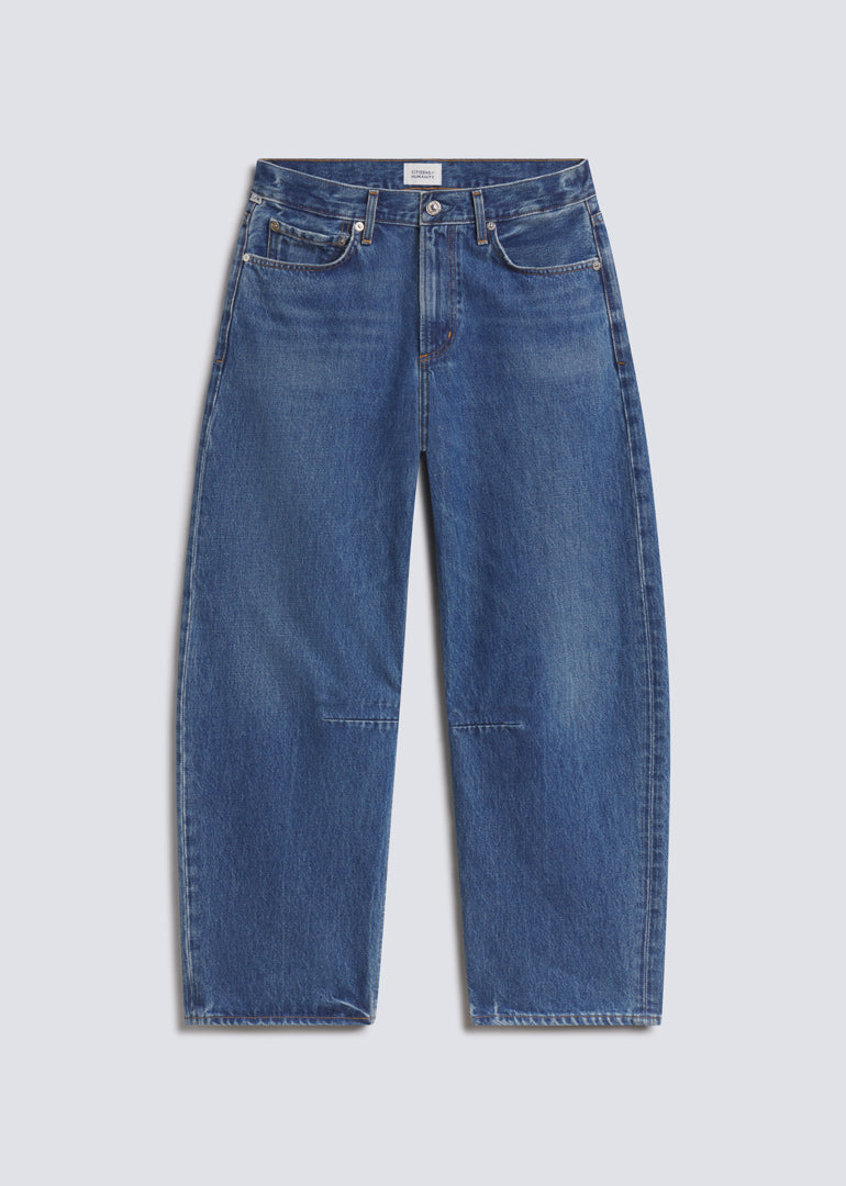 Miro Long in Azure Blue, featuring medium blue denim with subtle fading, a relaxed barrel leg silhouette, five-pocket design, and full-length fit, front view on a grey background.