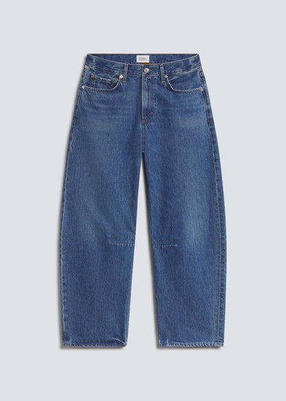 Miro Long in Azure Blue, featuring medium blue denim with subtle fading, a relaxed barrel leg silhouette, five-pocket design, and full-length fit, front view on a grey background.