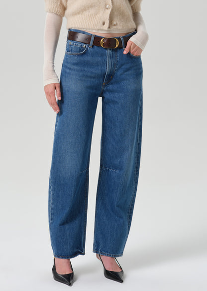 Close up shot of blue pants on a grey background