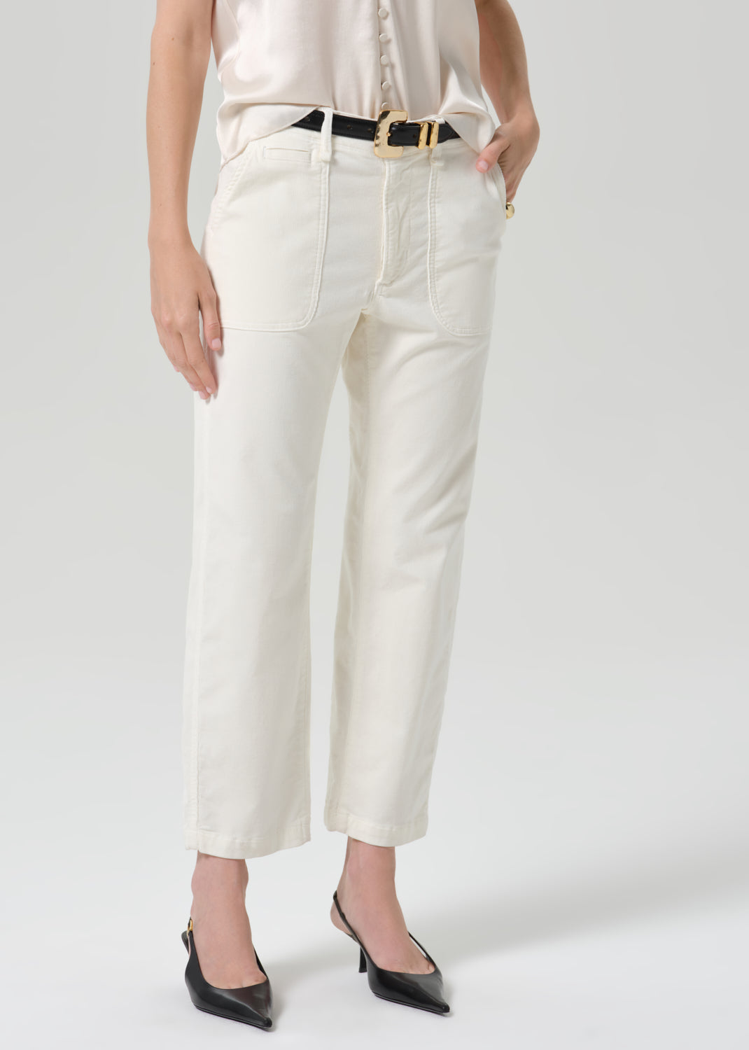 Close up of white pant on a grey background