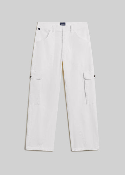 Pashmina white wide-leg utility pants with front patch pockets, side cargo pockets, twisted seam detailing, belt loops, and button closures, front flat lay view on a grey background.