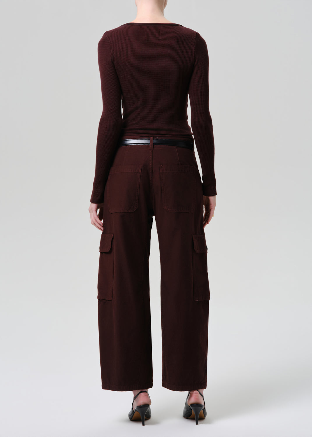 Brown long-sleeve top and wide-leg pants on a grey background