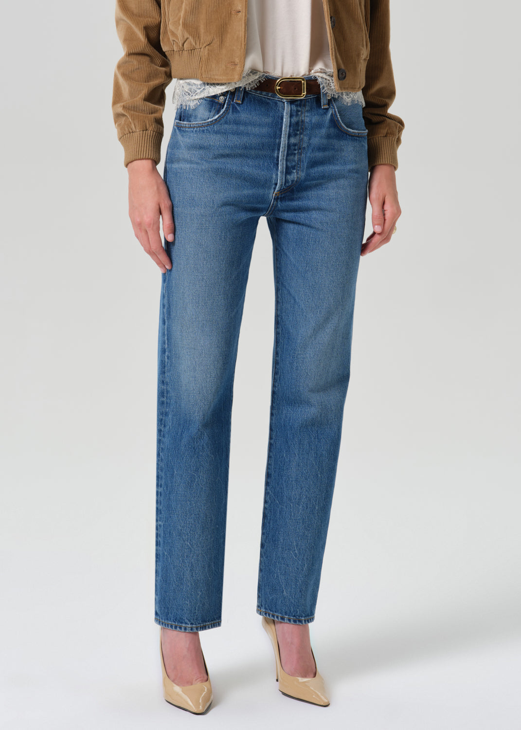 Close up shot of blue pants on a grey background