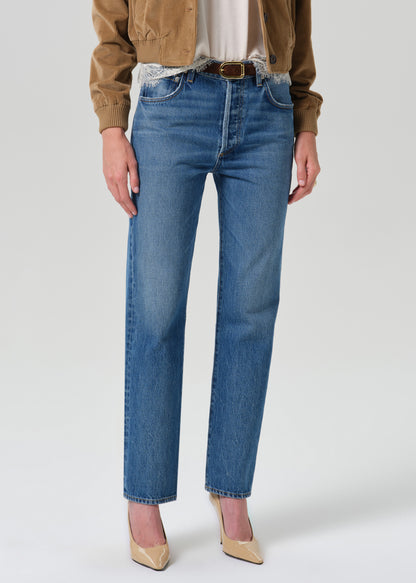 Close up shot of blue pants on a grey background