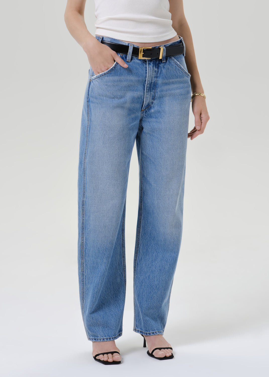 Close up shot of blue pants on a grey background