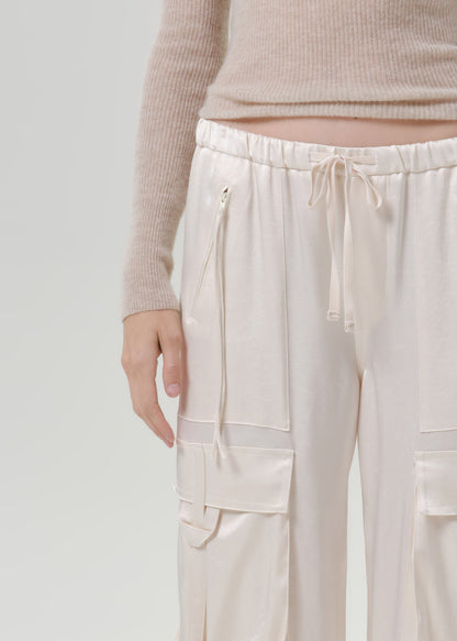 Close up of white pants on a grey background