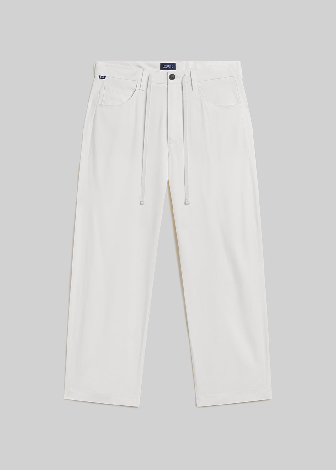 Winter white wide-leg wool trousers with a drawstring waistband, belt loops, front pockets, and button closure, front flat lay view on a grey background.