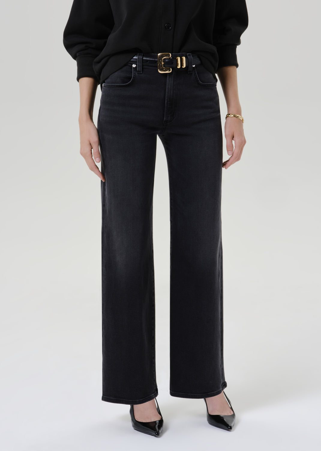 Close up shot of black pants on a grey background