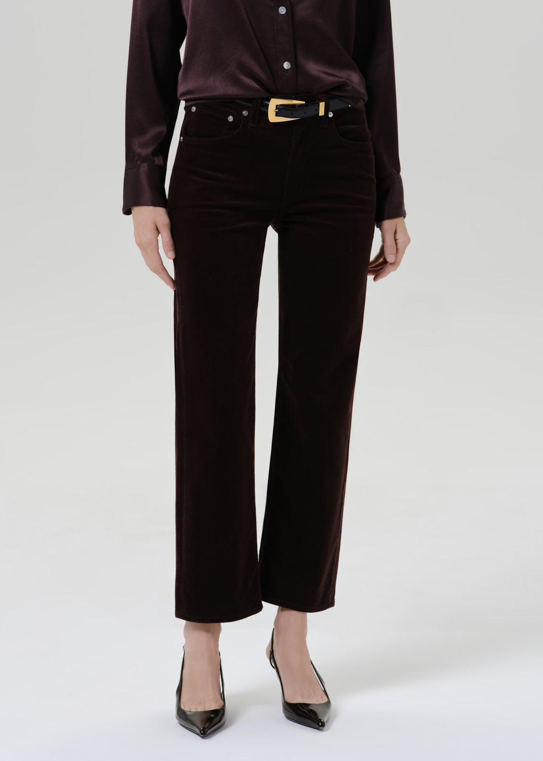 Close up of black pants on a grey background