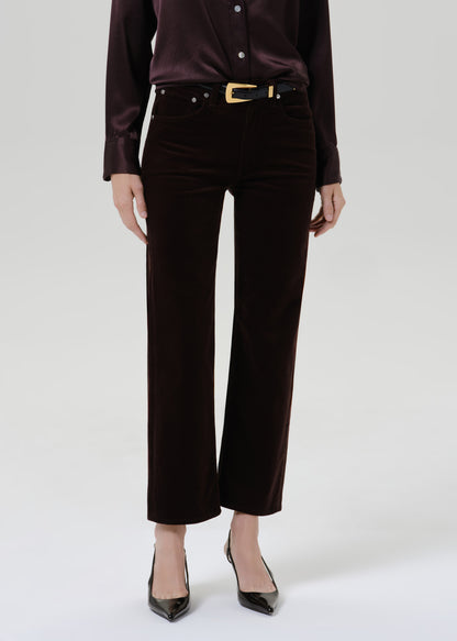 Close up of black pants on a grey background