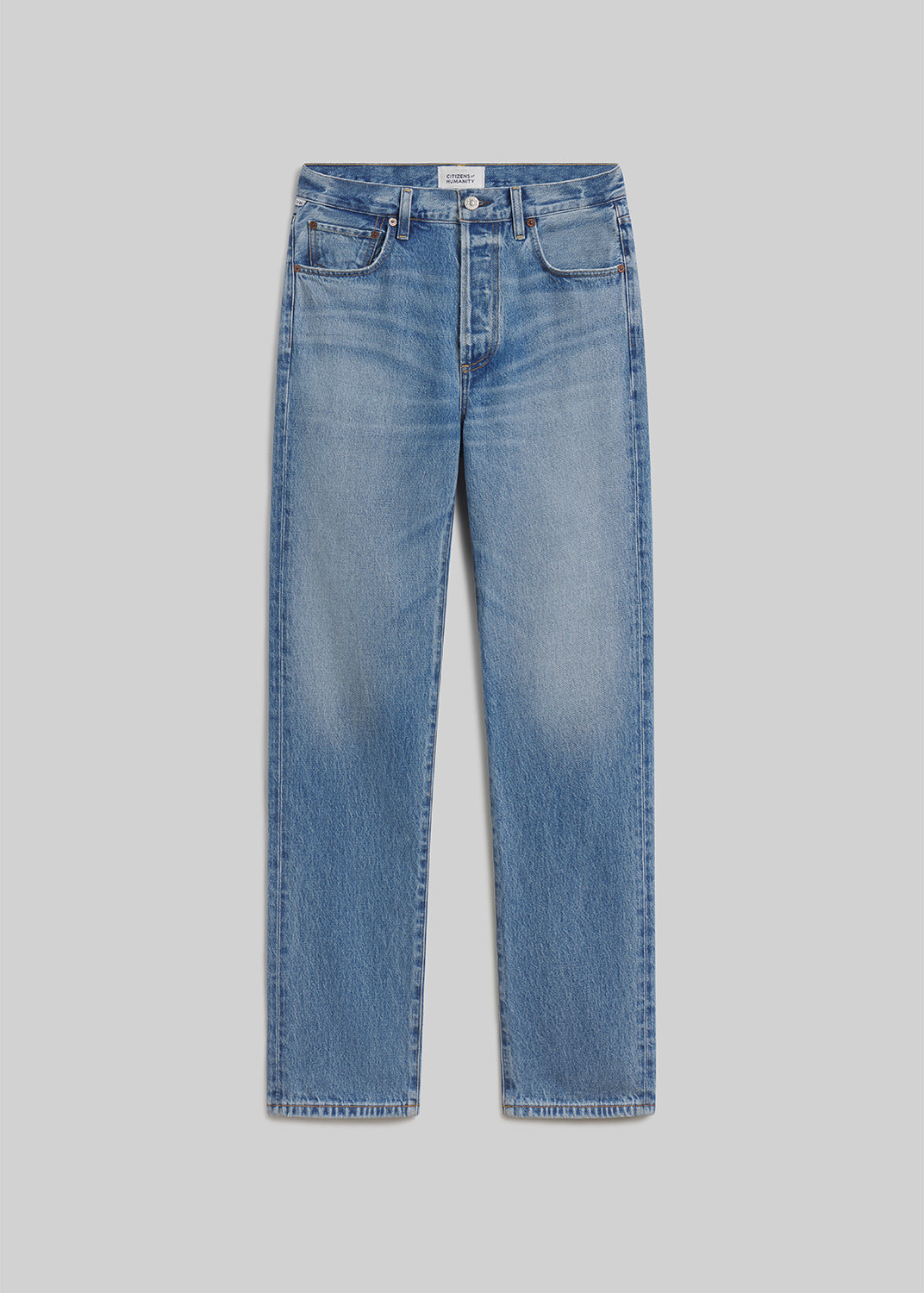 London blue straight-leg jeans on grey background