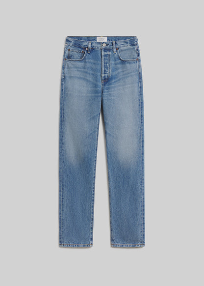 London blue straight-leg jeans on grey background