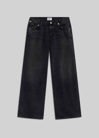 Vintage black wide-leg jeans on grey background