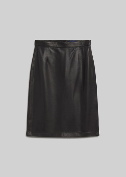 Black leather pencil skirt on grey background