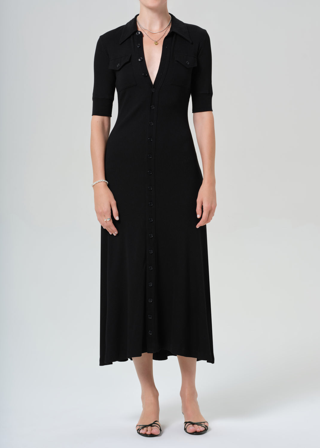 Amina Polo Dress
In Black