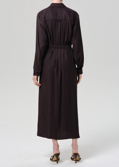 Dark brown dress with a belt on a grey background