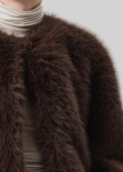 Close-up of a brown fur coat with a neutral background